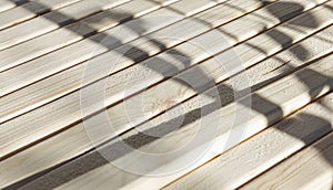 Wooden beams in a row on a sunny day. Construction and repair. Close-up. Space for text. Background