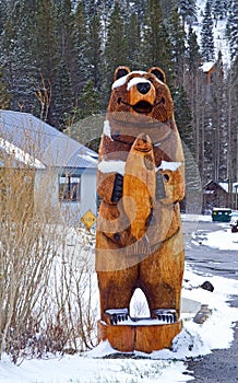 Wooden bear in snow