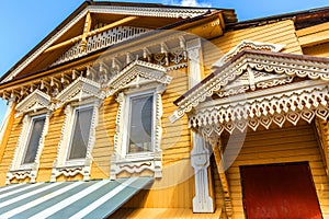 Wooden beautiful house with carved platbands.
