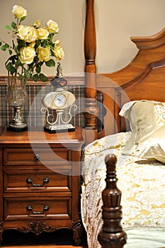 Wooden bed in bedroom photo