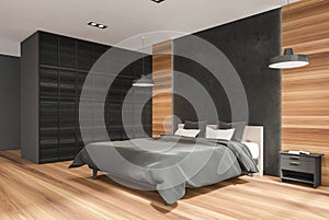 Wooden bedroom space with black wall partitions