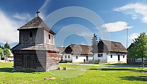 Wooden bell tower and folk houses