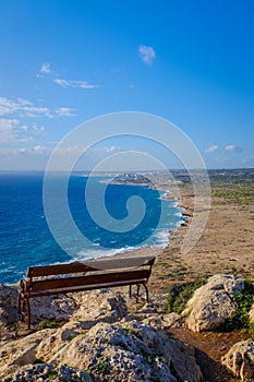 Wooden bench with a coastline view