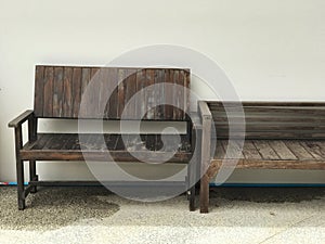 Wooden bench in front of the white wall, stock photo image