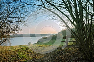 Wooden bench on a hill with outlook on the river trave in the mo