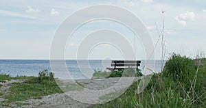 Wooden bench and Lake Ontario