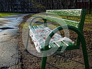 Wooden bench after rain in the Park