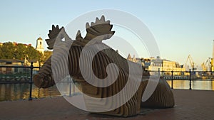 Wooden bench in the shape of a moose in the park