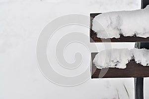 The wooden bench with snow