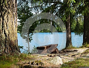 Wooden bench at Strbske pleso in Tatras mountains.