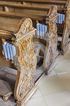 Wooden benches with Gotteslob in Austrian church