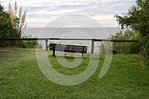 Wooden benches with ocean views in Buenos Aires Botanical Garden. Buenos Aires, Argentina