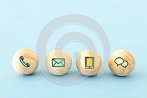 wooden bids with contact us icons. photo