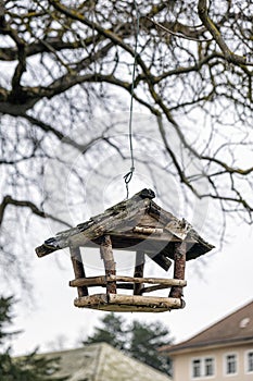 Wooden birdhouse on the tree