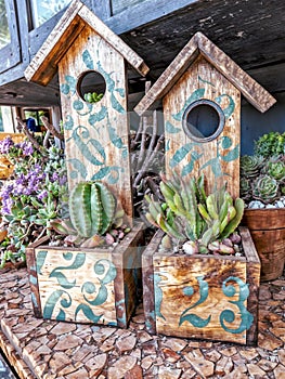 Wooden birdhouses in the garden. Decorative bird houses.