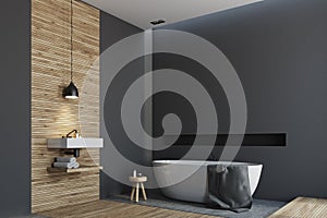 Wooden and black bathroom, round tub side