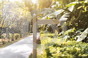 Wooden blank waypost template with the lane near, tropical resort photo