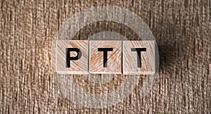 A wooden block with the acronym PTT spelled on it, representing the medical term Partial Thromboplastin Time photo