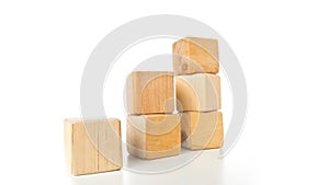 Wooden block building pieces forming steps in stop motion - career, growth or development concept