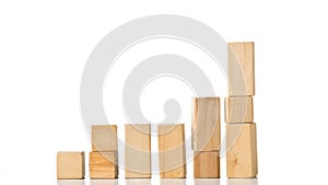 Wooden block building pieces forming steps in stop motion - career, growth or development concept