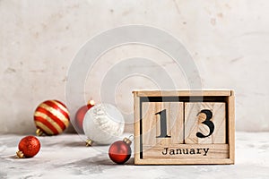 Wooden block calendar and decor on table.