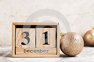 Wooden block calendar and decor on table
