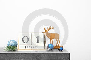 Wooden block calendar and decor on table. Christmas countdown