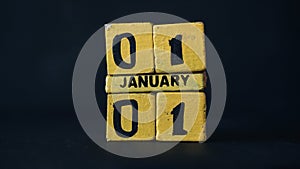 Wooden block calendar with focus on 01 January 01