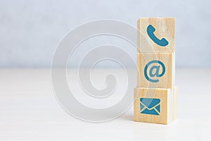 Wooden block cube symbol telephone, email, address. marketing concept