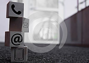 Wooden block cube symbol telephone, email, address. Website page contact us or e-mail marketing concept