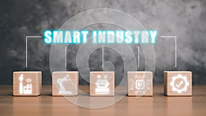 Wooden block on desk with smart industry icon on virtual screen