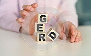 wooden block form the word Gerd with stethoscope on the doctor's desktop, medical concept