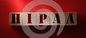 Wooden block form the word HIPAA Health Insurance Portability and Accountability Act. Medical concept