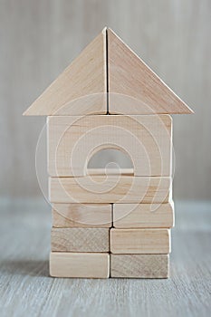 Wooden block house on white background. wooden building blocks different forms