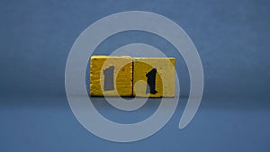Wooden block with number 11. Yellow color on dark background