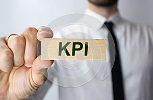 a wooden block with the word: KPI