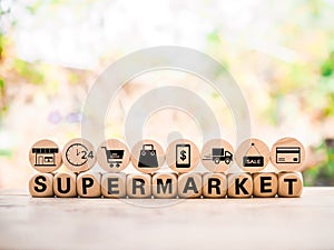 Wooden block with word SUPERMARKET and online shopping, e-commerce icons set