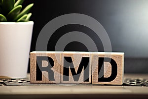 wooden block with words RMD required minimum distributions