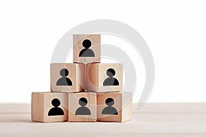 Wooden blocks with employee icon on white background. Leadership, human resources management, recruitment or corporate hierarchy