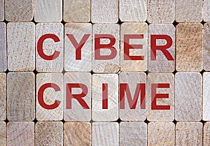 Wooden blocks form the word `cybercrime`. Beautiful wooden background