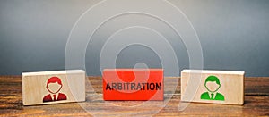 Wooden blocks with the image of two people and the word Arbitration between them. Alternative dispute resolution. Resolve disputes photo