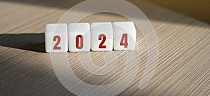 Wooden blocks with the inscription 2024. Setting goals and objectives for the new year. Planning, business management and strategy