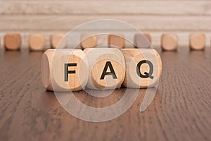 wooden blocks with the letters faq on them