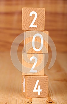 Wooden blocks lined up with the letters 2024. Represents the goal setting for 2024, the concept of a start