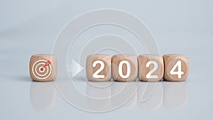Wooden blocks lined up with the letters 2024. Represents the goal setting for 2024, the concept of a start. financial planning