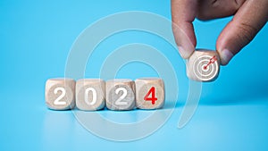 Wooden blocks lined up with the letters 2024. Represents the goal setting for 2024, the concept of a start. financial planning