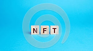 Wooden blocks NFT - non-fungible token. Digitally represented product or asset. Selling digital assets and art through auctions.