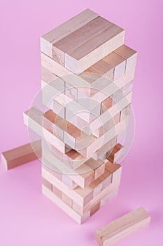 Wooden blocks on pink background