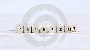 Wooden blocks with problem and solution sign.