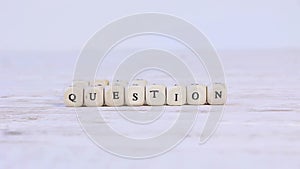 Wooden blocks with question and solution sign.